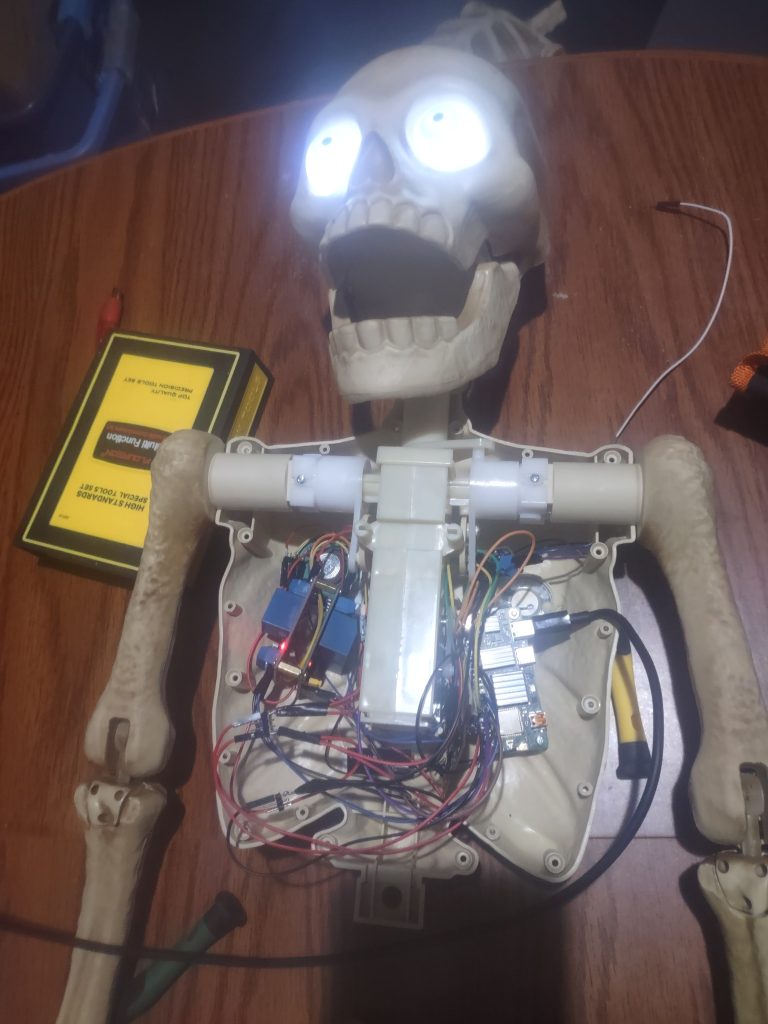 Photo showing the Radxa Zero 3W and relays mounted inside the skeleton’s chest cavity
