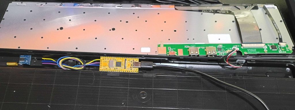 Milkv Duo and RYLR998 module both fitted within the bezzle of a standard keyboard.